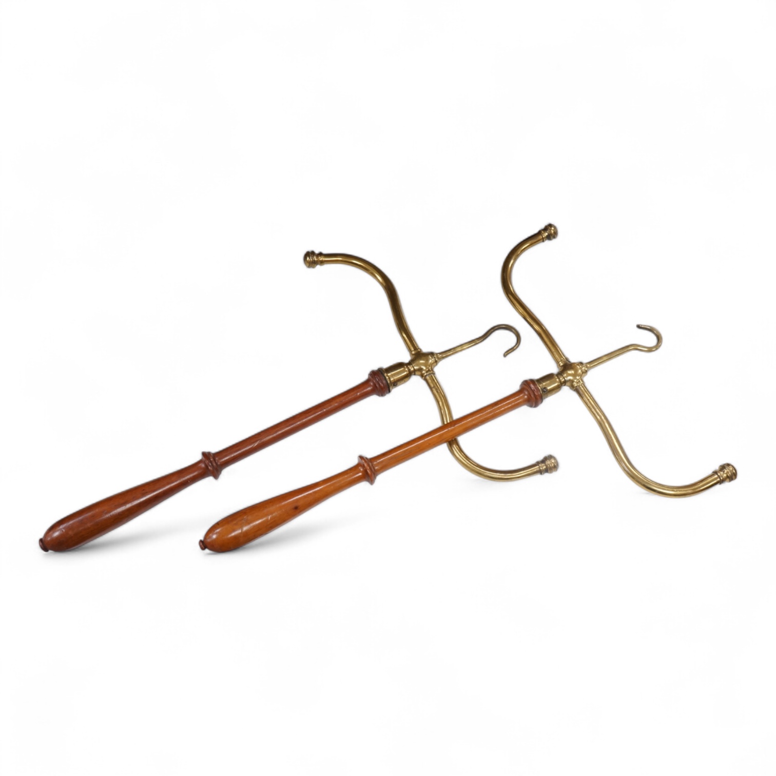 A pair of Barrister’s mahogany and brass gown and wig stands.